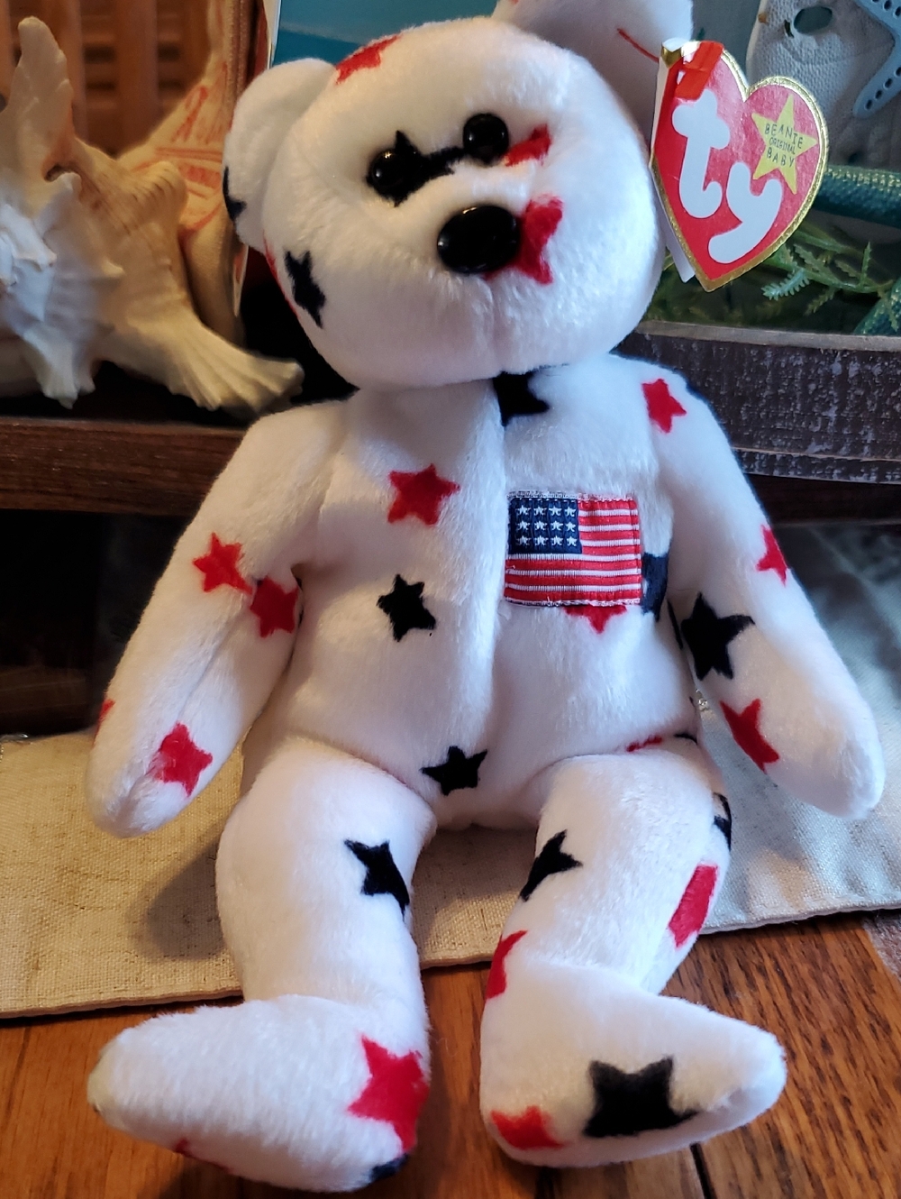 Ty "Glory" White Plush Bear with Red and Black Stars and Flag Patch